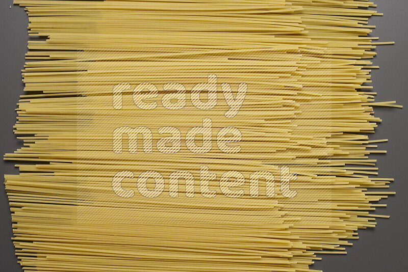 Spaghetti pasta on grey background