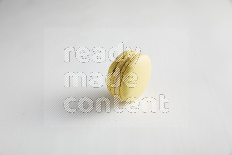 45º Shot of Yellow Lime macaron on white background