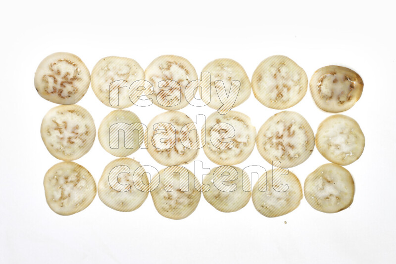 Eggplant slices on illuminated white background