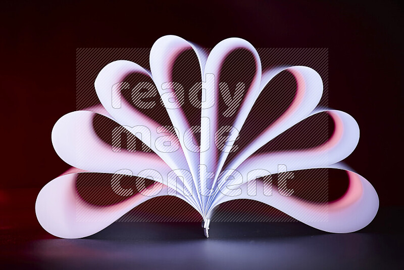 An abstract art piece displaying smooth curves in pink and white gradients created by colored light