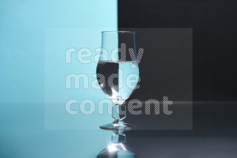 The image features a clear glassware filled with water, set against light blue and black background