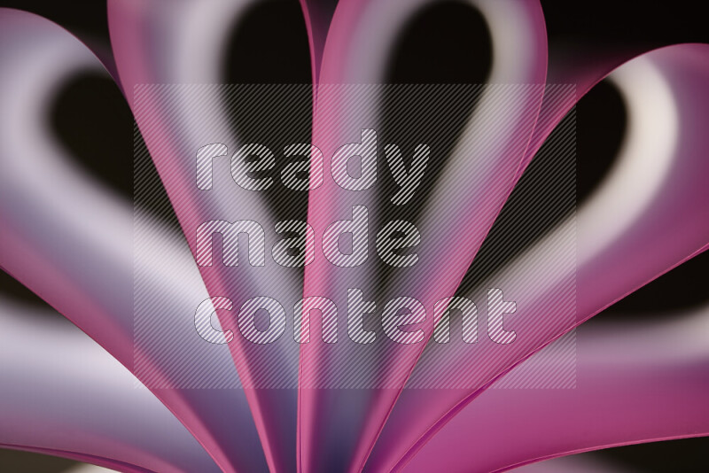 An abstract art piece displaying smooth curves in white and pink gradients created by colored light
