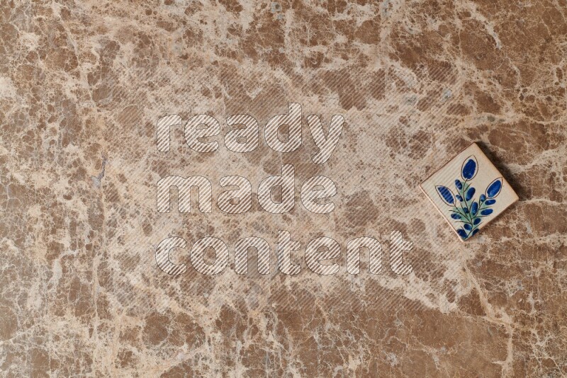 A decorative coaster on beige marble background
