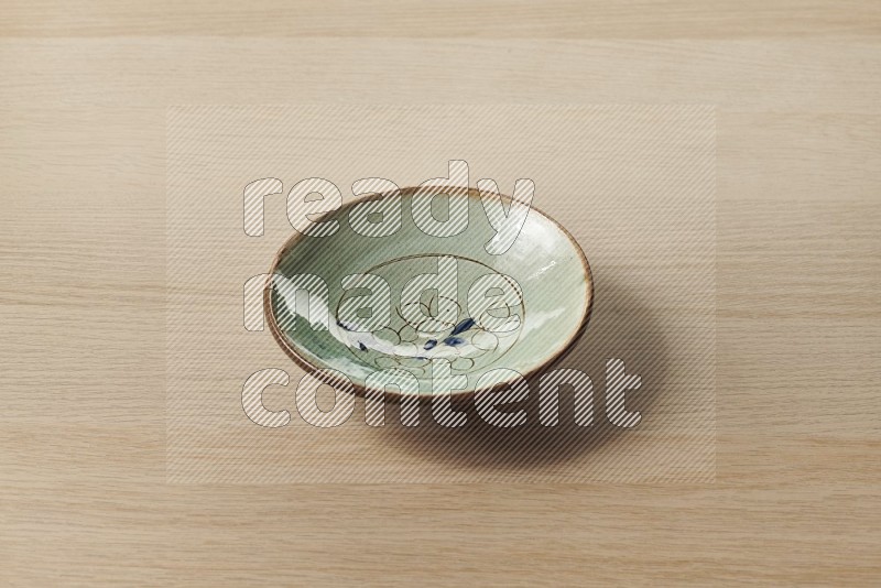 Decorative Pottery Plate on Oak Wooden Flooring, 45 degrees