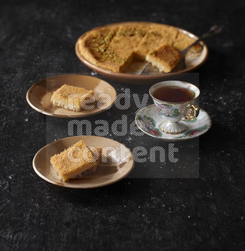 konafa with tea in a dark setup