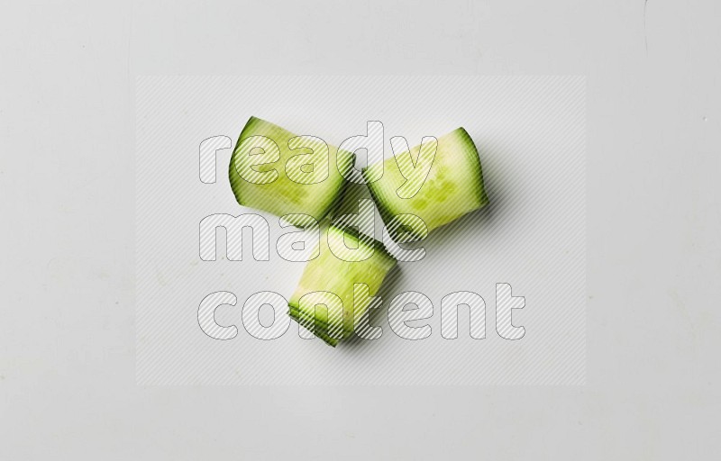 Three cucumber ribbons on a white background