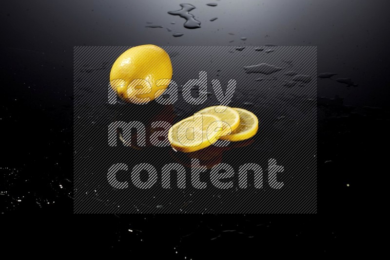 Lemon slices with water drops, and droplets on black background