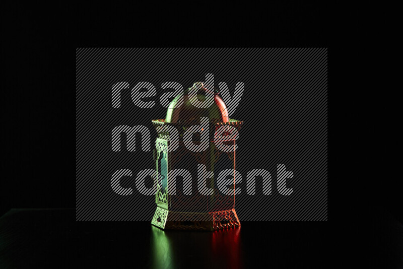 Ramadan lanterns with colored rim light against black background