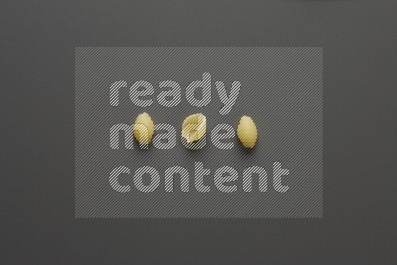 Shells pasta on grey background