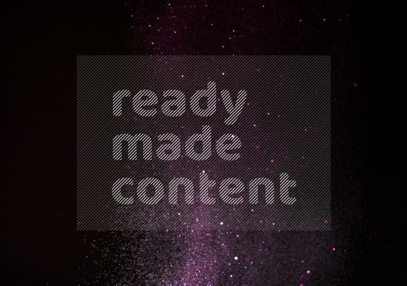 Pink glitter powder isolated on black background