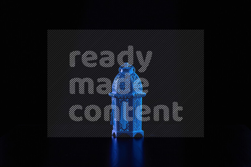 Ramadan lanterns with colored rim light against black background