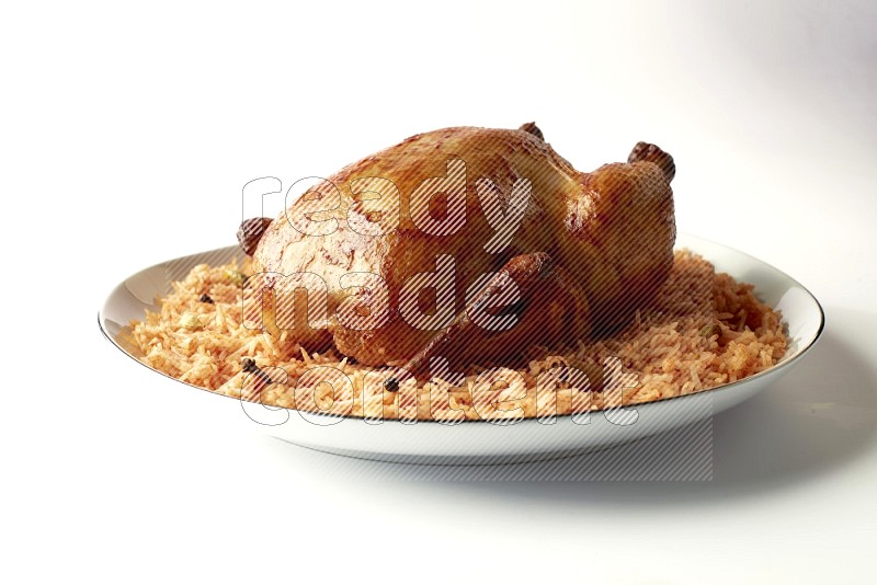 red basmati Rice with whole roasted chicken on a white plate with a silver rim direct on white background