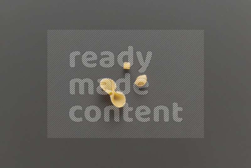 Different pasta types on grey background