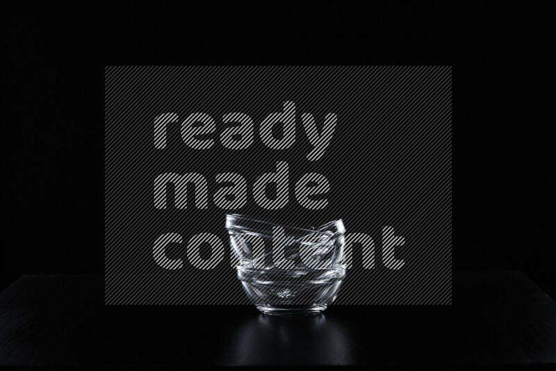 Glassware with rim light against black background