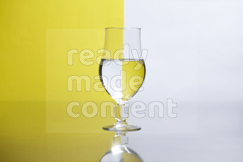 The image features a clear glassware filled with water, set against white and yellow background