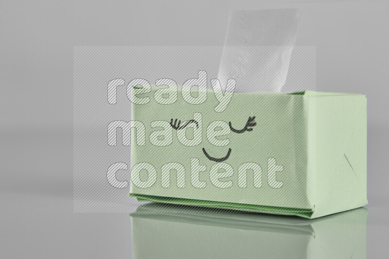 Origami tissue box on grey background