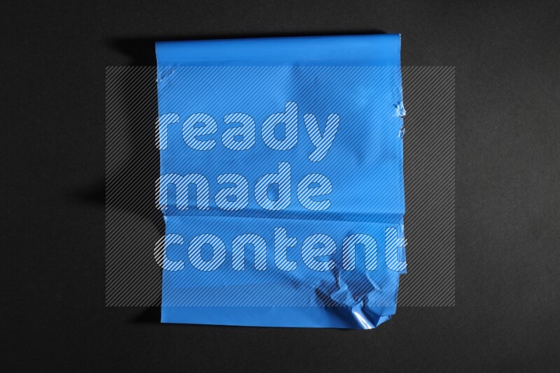 Colored plastic textures on black background