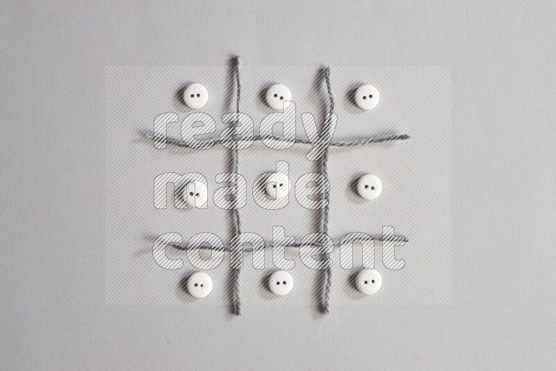 White buttons placed on grey background