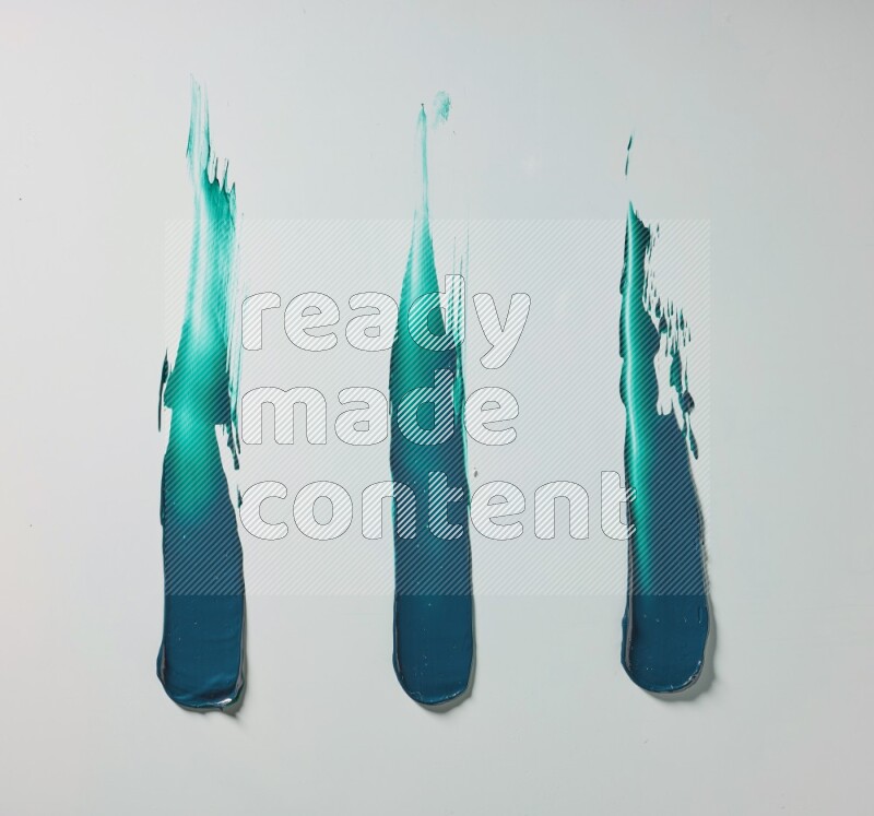 Turquoise painting knife strokes on white background