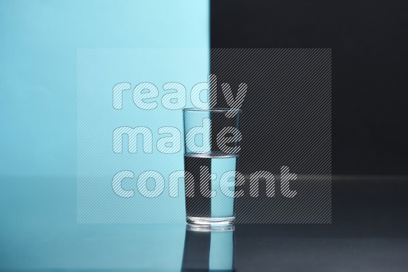 The image features a clear glassware filled with water, set against light blue and black background