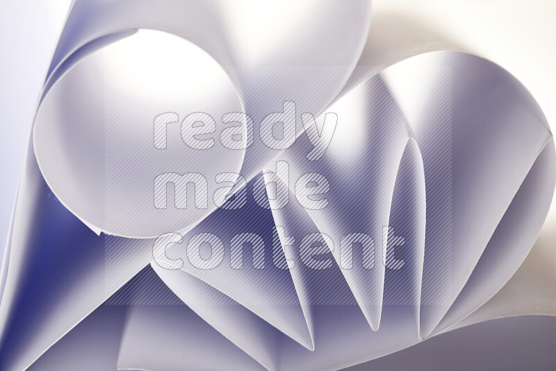 An artistic display of paper folds creating a harmonious blend of geometric shapes, highlighted by soft lighting in grey