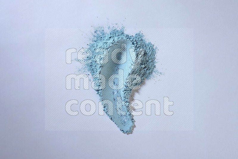 Blue powder strokes on white background