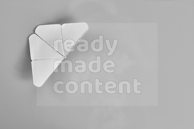 Origami butterfly on grey background