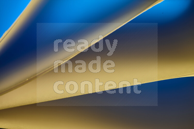 An abstract art piece displaying smooth curves in warm and cold gradients created by colored light