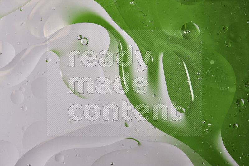Close-ups of abstract oil bubbles on water surface in shades of white and green