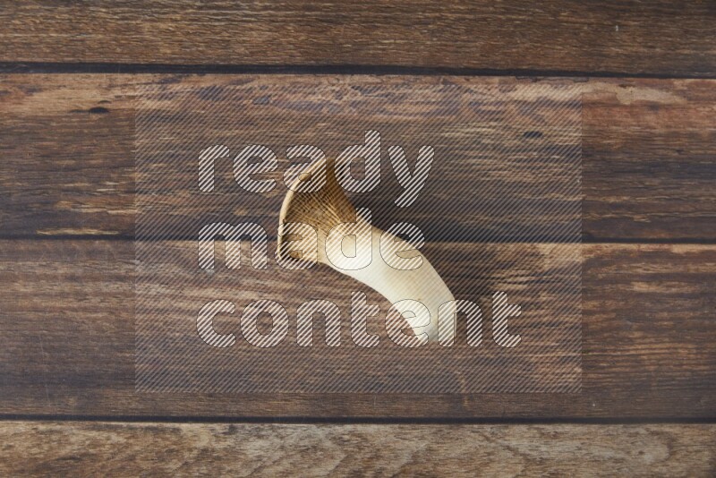 Fresh King oysters mushrooms topview on a wooden background