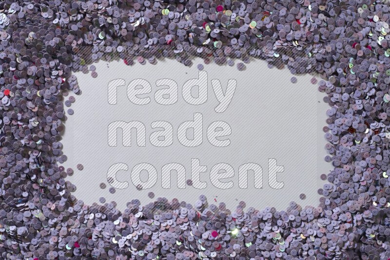 ترتر مسطح متعدد الألوان على خلفية رمادية