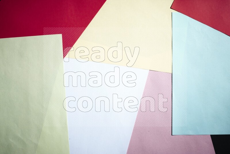 Multicolored paper sheet on black background