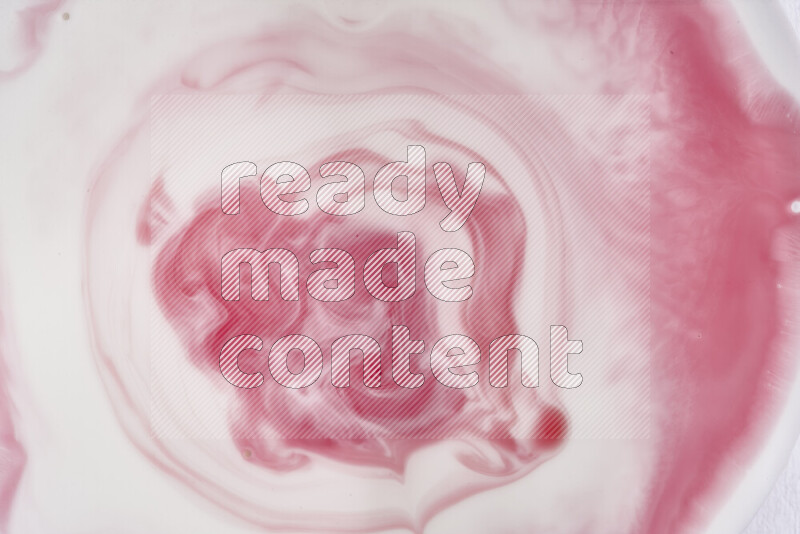 A close-up of abstract swirling patterns in red and white