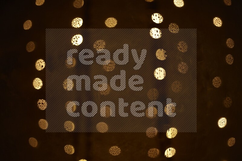 Bokeh light in yellow with water drops