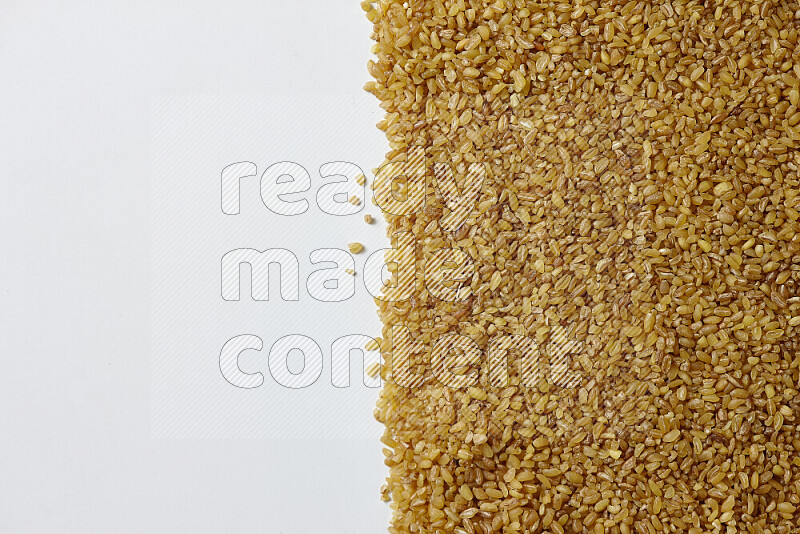 Coarse bulgur on white background