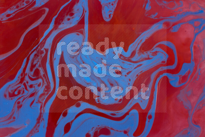The image depicts a marbling effect with swirling patterns of red and blue