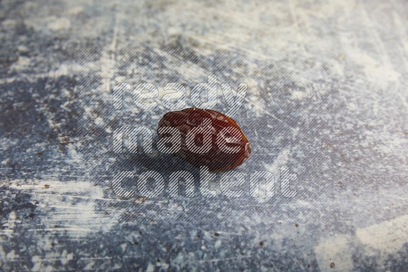 one madjoul date on a rustic blue backround