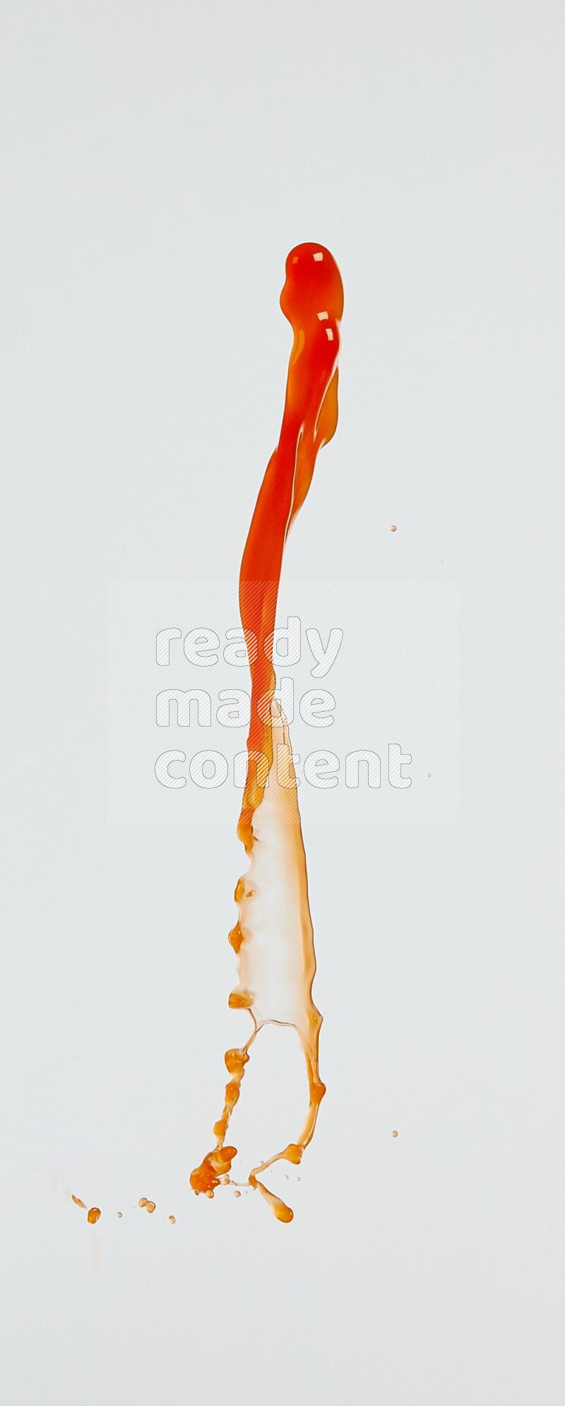 Orange liquid splash and drops on white background