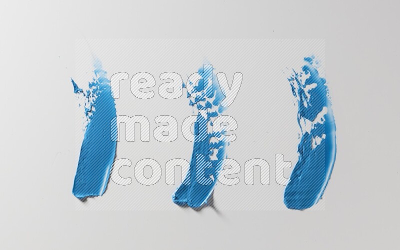 Blue painting knife strokes on white background