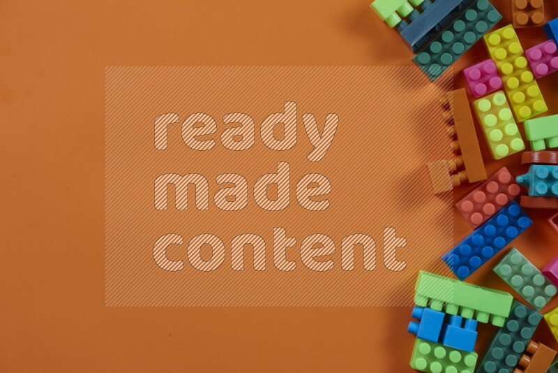 Multicolored plastic building blocks on different backgrounds (kids toys)