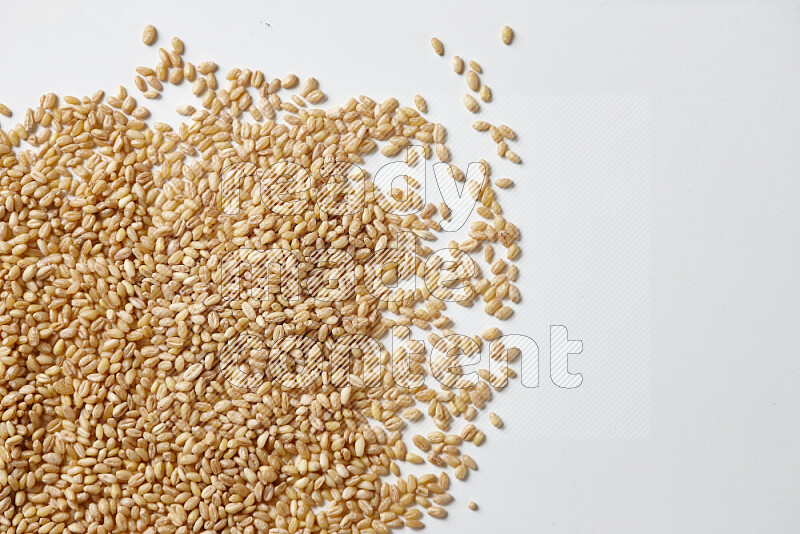 Hulled wheat on white background