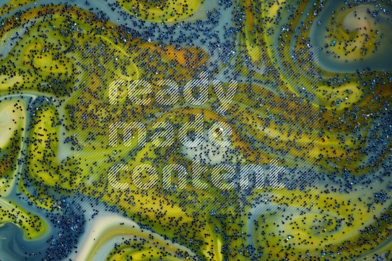 لقطة مقربة لبريق أزرق متلألئ منتشر على خلفية من اللون الأزرق والأصفر في حركات دائرية