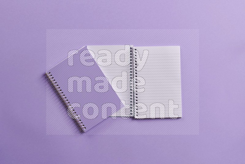 A purple notebook on purple background (Back to school)
