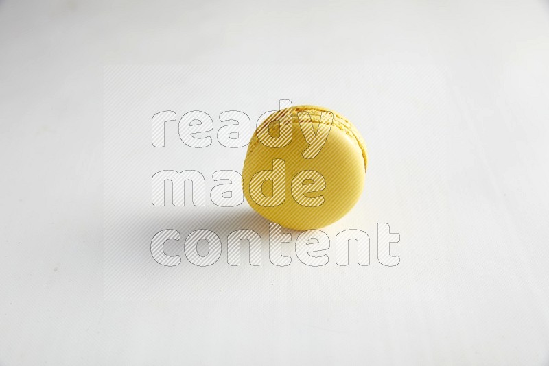 45º Shot of Yellow Lemon macaron on white background