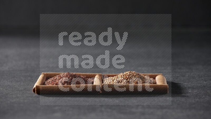 2 squares of cinnamon sticks full of mustard seeds and garden cress on black flooring