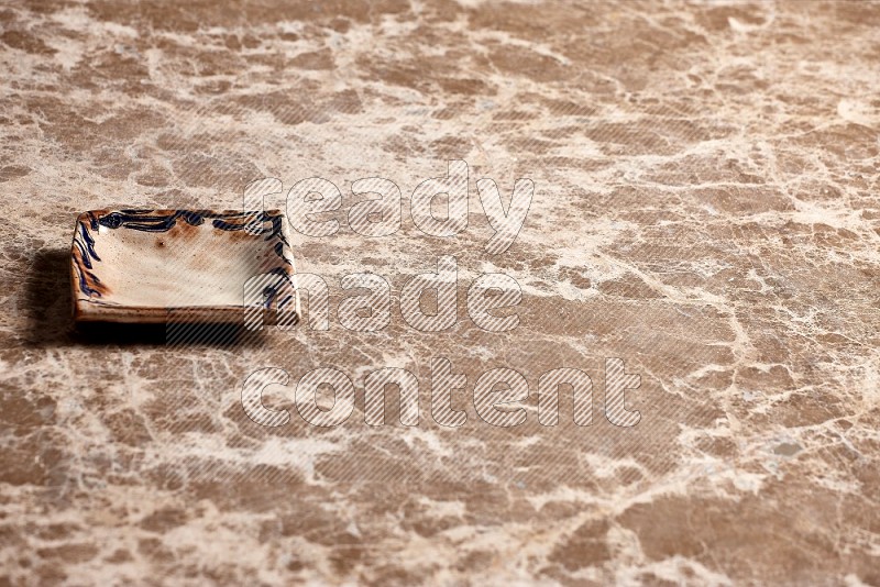 Decorative Pottery Plate on Beige Marble Flooring