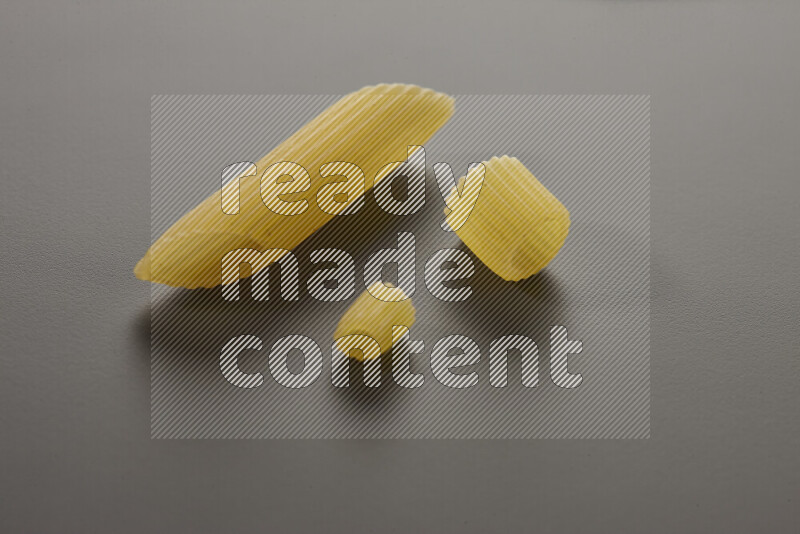 Different pasta types on grey background