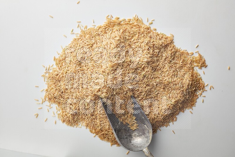 Long grain brown rice on white background