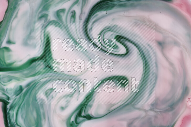 A close-up of abstract swirling patterns in red and green