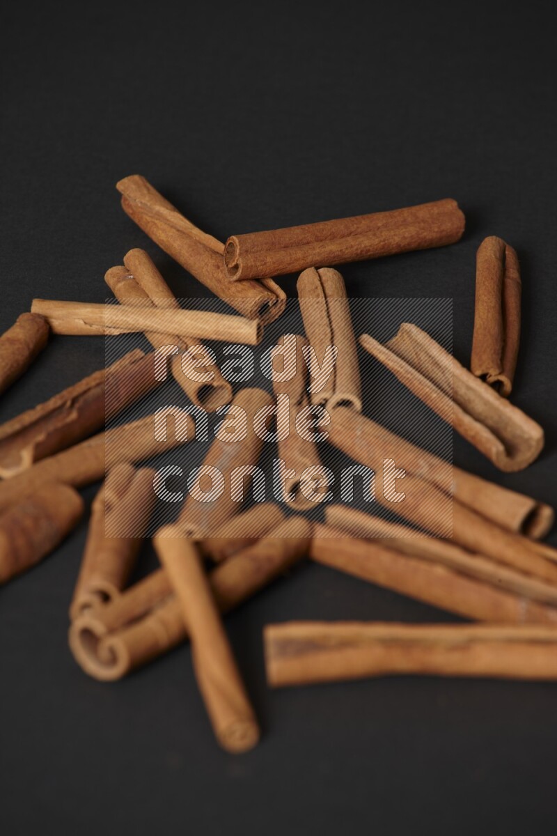Cinnamon sticks on black background